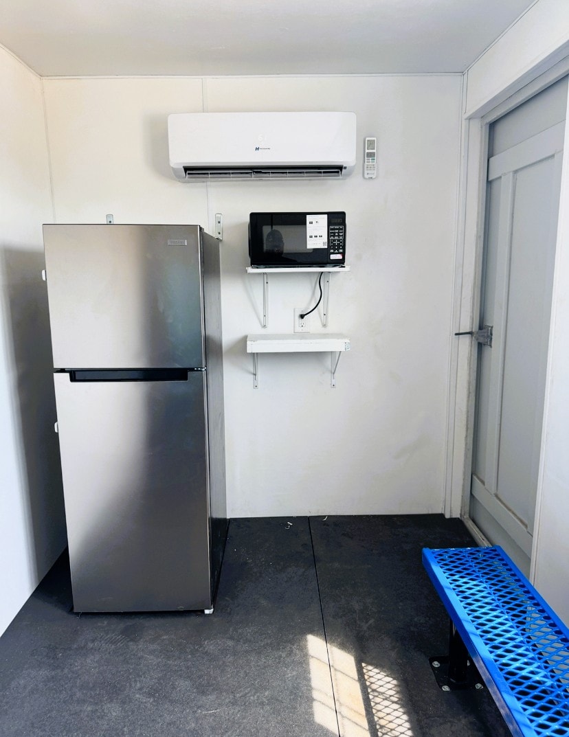 Microwave, refrigerator, and amenities inside a SureHold cooldown container