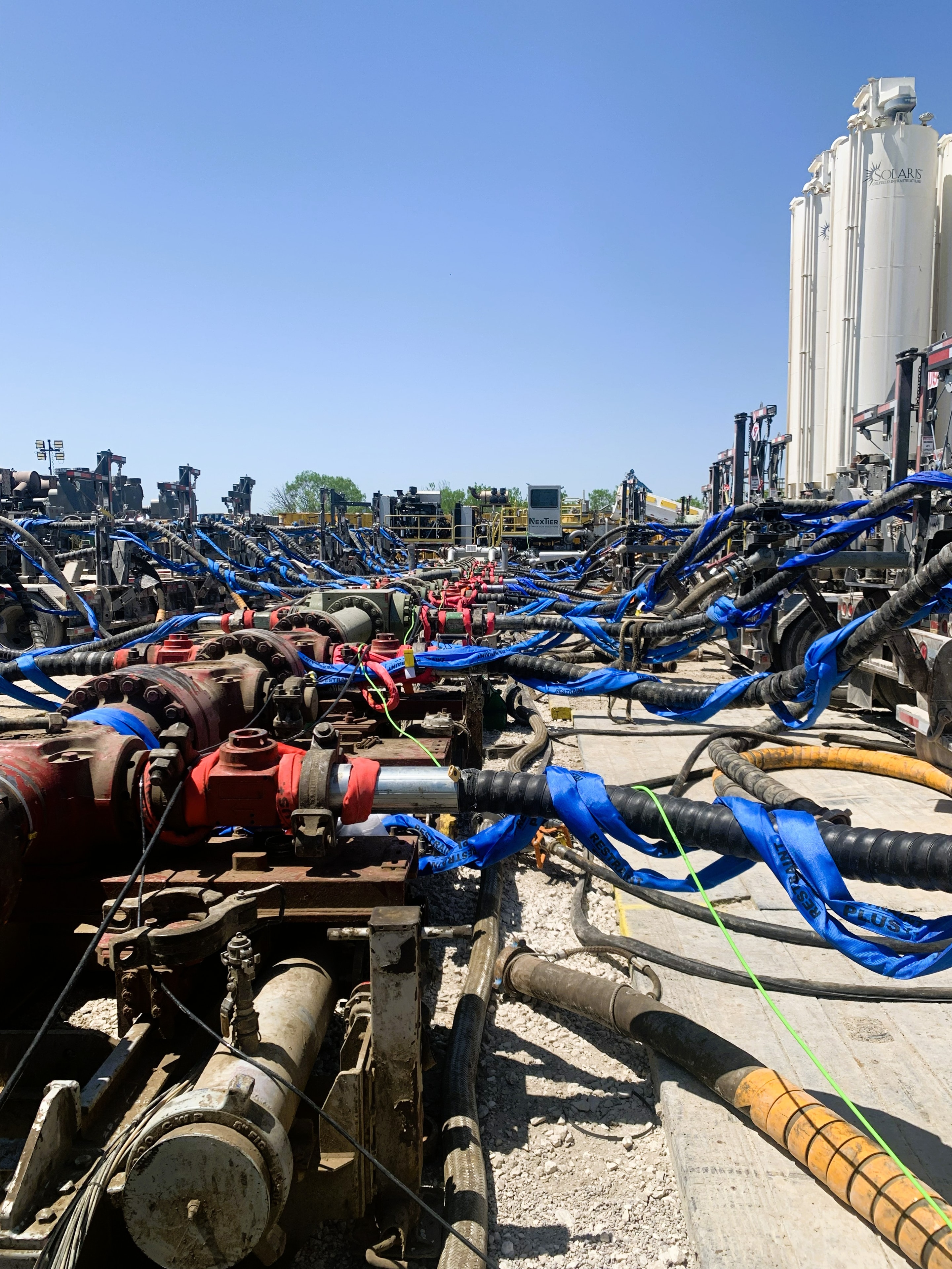 SureHold flowline restraint systems deployed across an active high-pressure frac site